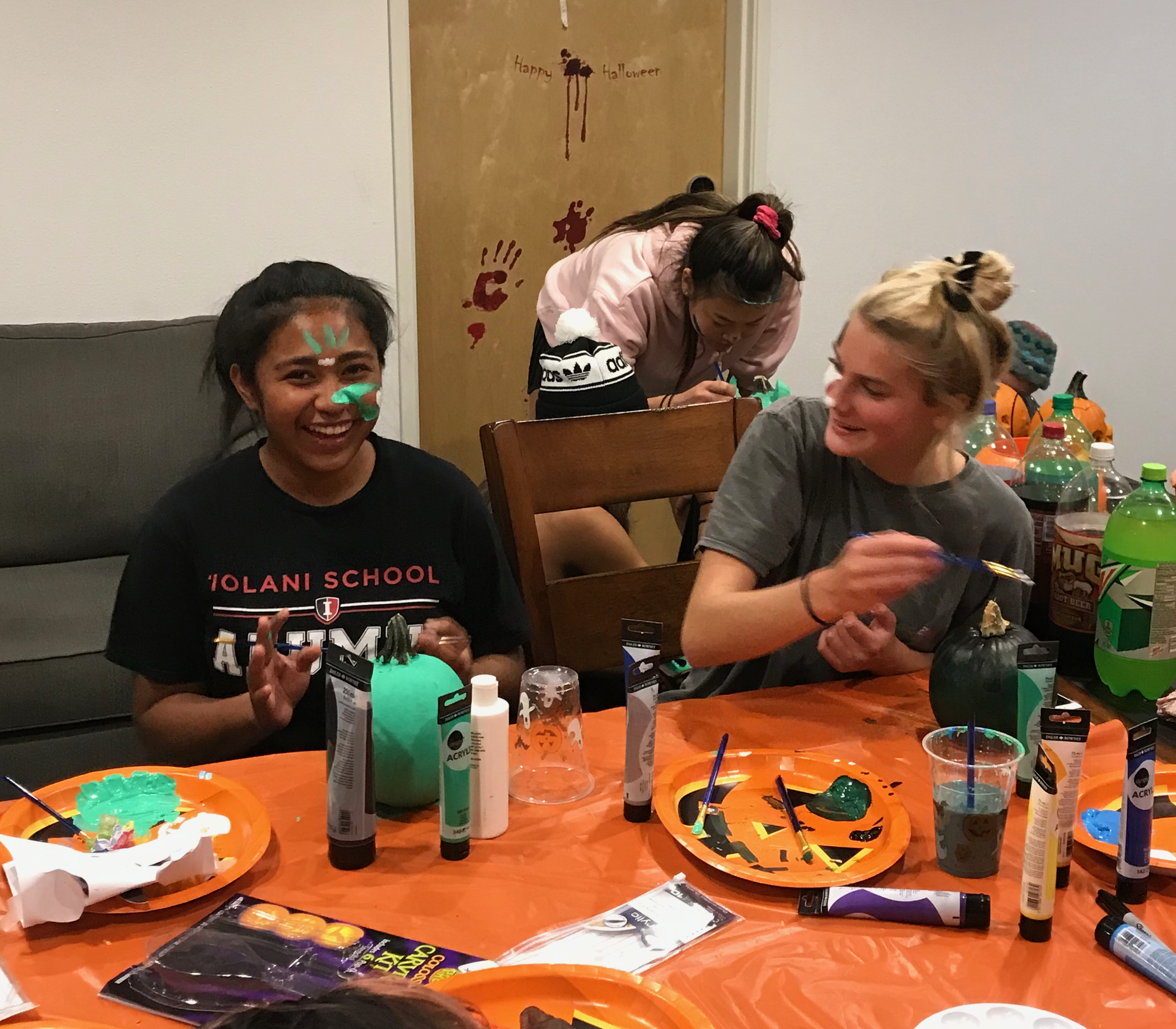 Painting faces as well as pumpkins