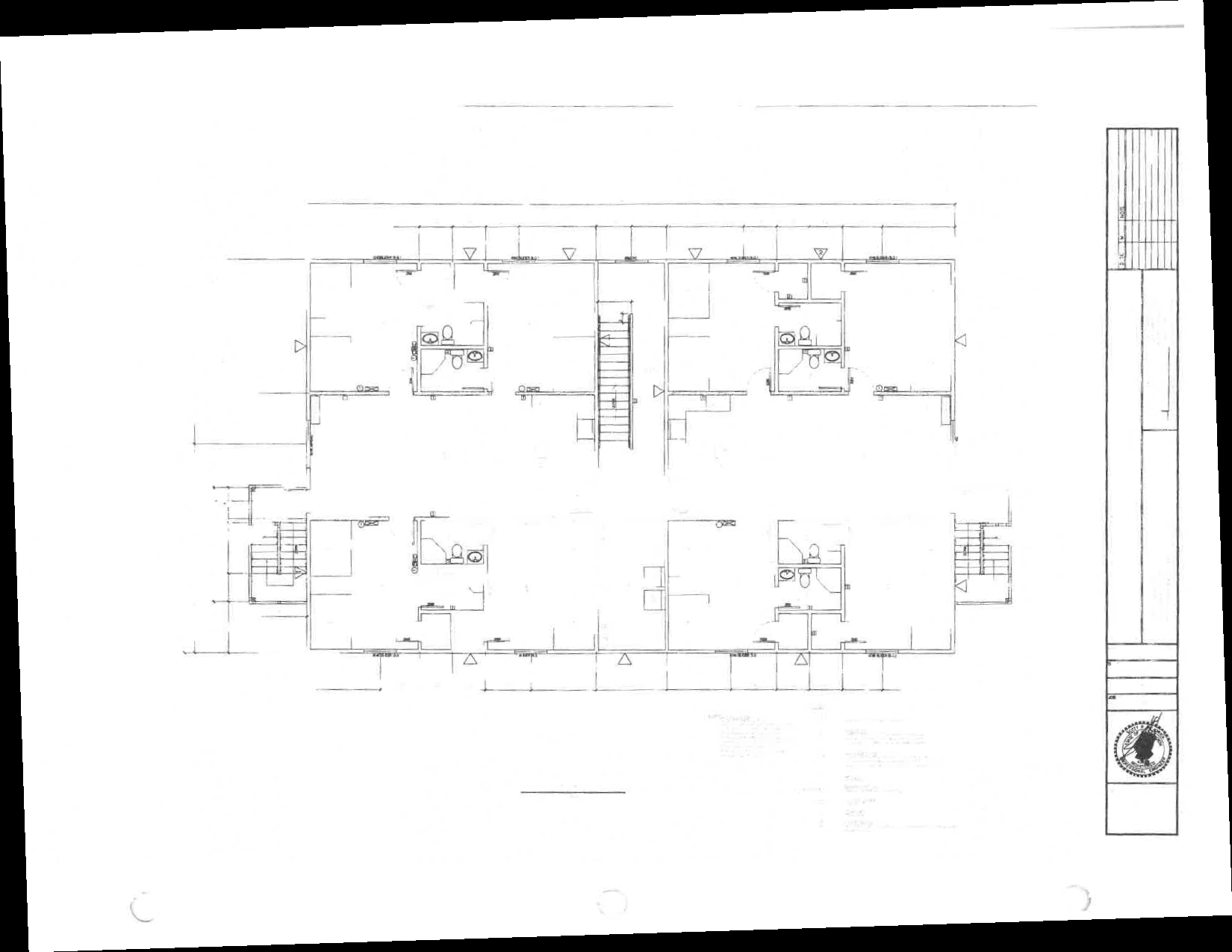 The floorplan of a typical suite, showing four bedrooms, each with a private bathroom and closet. The bedrooms share a common kitchen and living room.